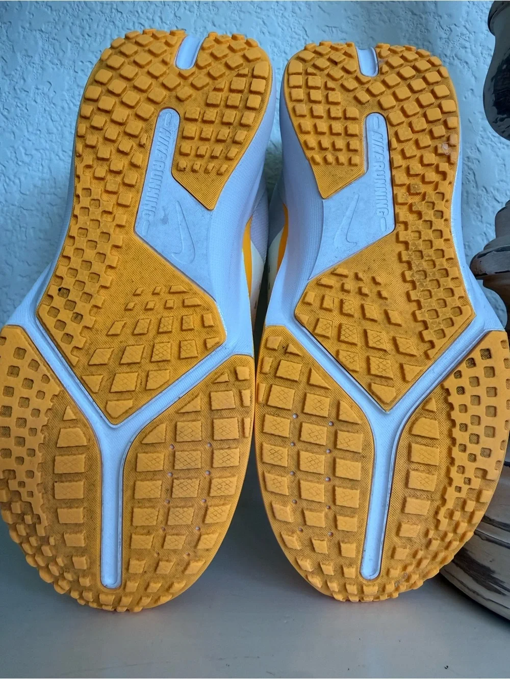Nike Kids White Sneakers with Orange Toe and Blue Accents